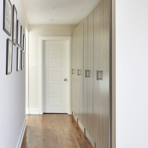 toronto mid-century luxury home hallway - custom millwork-storage solutions - wood flooring - built in storage - linda mazur design toronto designer