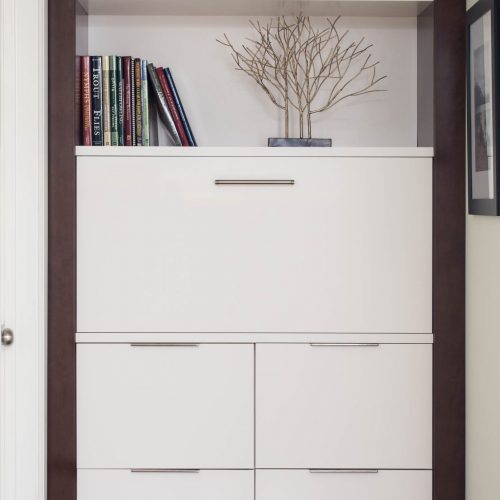 newmarket midcentury home custom millwork - extra hallway storage concealed charging station - white cabinetry linda mazur design york region designer