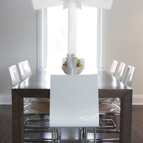 modern dining room with wood table - cantilever white dining chairs and modern white chandelier - linda mazur design toronto designer