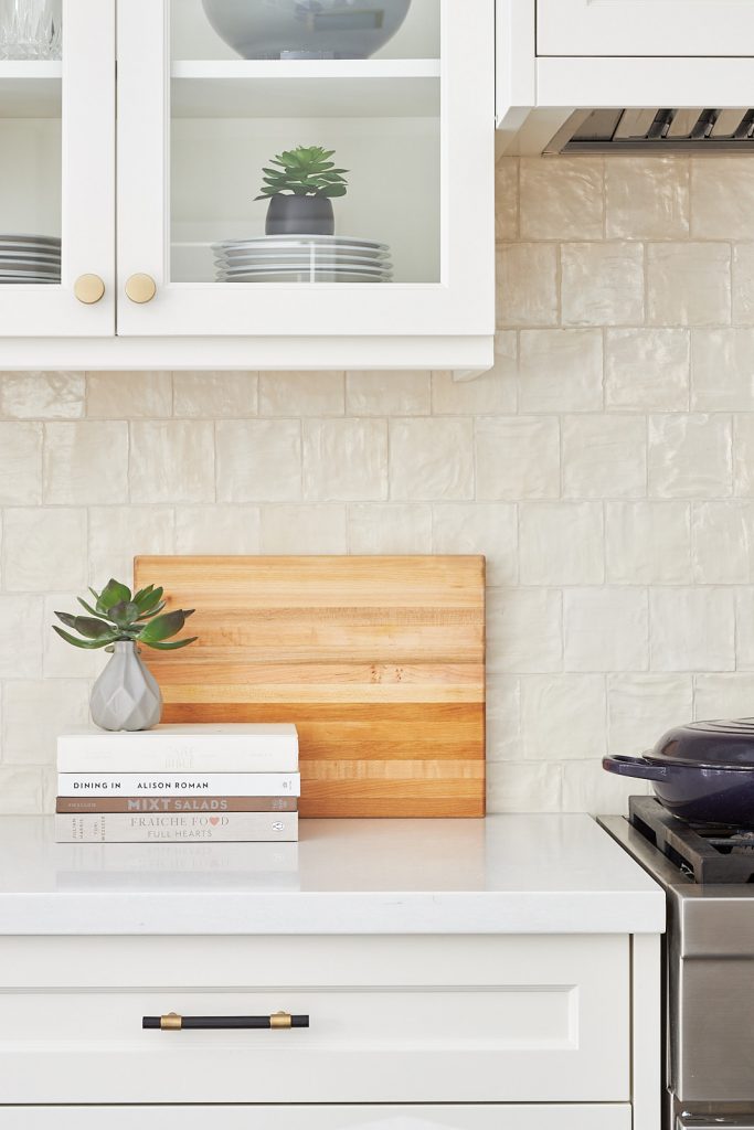 markham kitchen renovation cream custom millwork with square mallorca tile backsplash and glass cabinetry - custom range hood - luxury kitchen - family home - linda mazur design