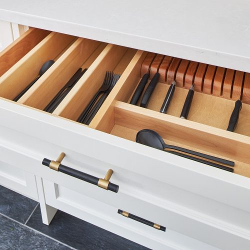 markham luxury kitchen custom drawer insert with knife block - black cutlery CB2 - black and gold cabinet pulls, custom cream coloured millwork with black porcelain floors and white quartz counter tops - linda mazur design toronto