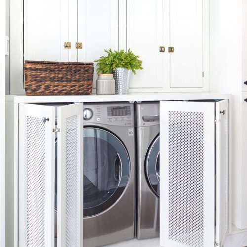 small space laundry - built in concealed laundry area - mesh door fronts - historic home - custom cabinetry - white cabinetry - linda mazur design - toronto designer - luxury family home - second floor laundry space