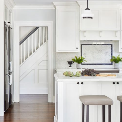 historic luxury toronto home- transitional black and white kitchen - custom millwork - vintage vibe in kitchen - quartz countertops - family home - wall paneling - linda mazur design toronto designer