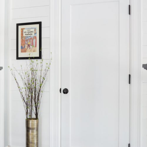 toronto family home - shiplap wall paneling - black and white spaces - black door hardware - wood flooring - linda mazur design toronto designer