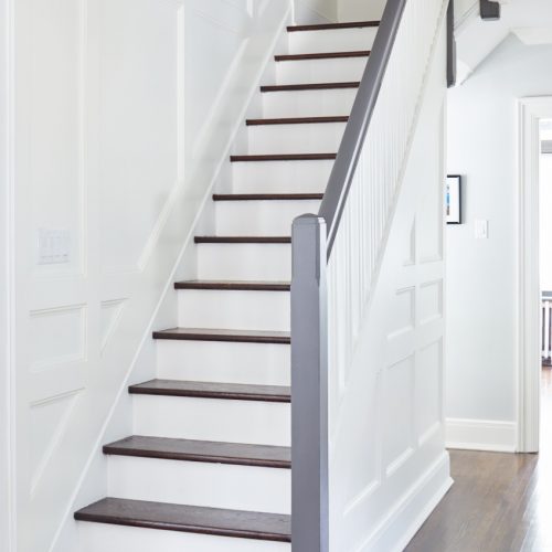 historic toronto home - black and white staircase - white custom wall paneling - wood floors - toronto designer - linda mazur design
