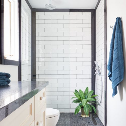 black and cream master ensuite - newmarket homes - black quartz counters with wall mount faucets - custom vanity millwork - cement tile floor - patterned floor - linda mazur design toronto designer - small space challenges