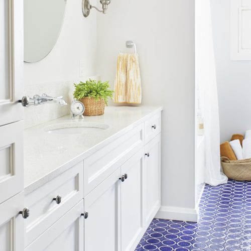 newmarket bathroom renovation - bright blue patterned floor tiles - white custom cabinetry - quartz counters - boho vibe - linda mazur design toronto designer