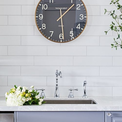 condo kitchen renovation - no upper cabinets white tiled wall