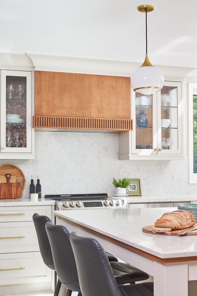 mississauga custom kitchen renovation - coffee station and pantry area - wood cabinetry and glass door front - toronto designer linda mazur design - kitchen island with quartz counters - transitional kitchen