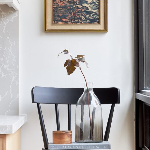 toronto condo kitchen renovation scandi, black barstool vignette, quartz counter tops, natural wood cabinets, two colour cabinets, white cabinets, custom kitchen, herringbone floors, toronto designer, linda mazur design