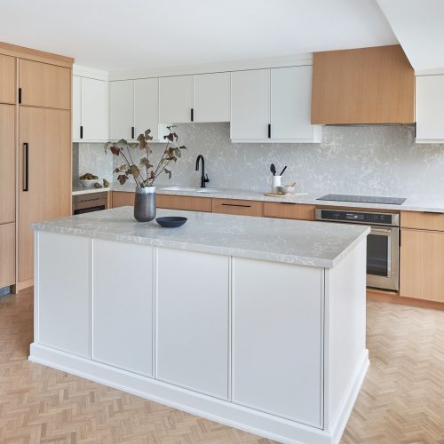 toronto condo kitchen renovation scandi, black barstool vignette, quartz counter tops, natural wood cabinets, two colour cabinets, white cabinets, custom kitchen, herringbone floors, toronto designer, linda mazur design